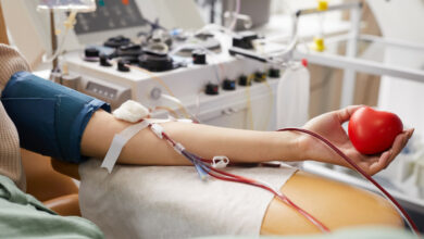 close-up-female-patient-with-tubes-her-arm-lying-couch-while-donating-blood-hospital