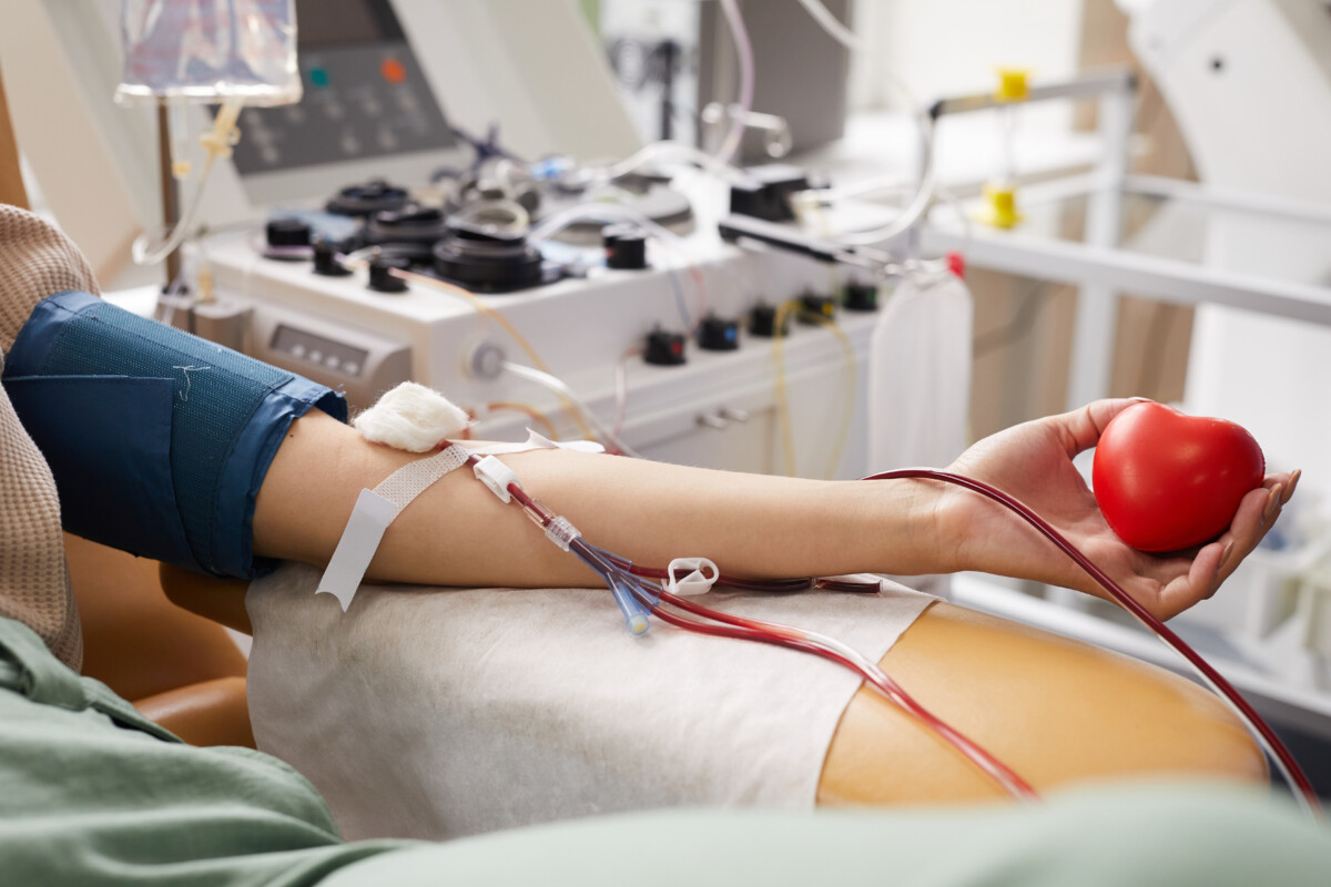 close-up-female-patient-with-tubes-her-arm-lying-couch-while-donating-blood-hospital