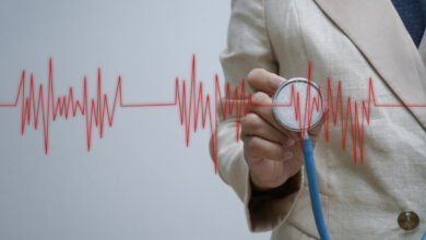 doctor-hand-with-stethoscope-listening-heartbeat