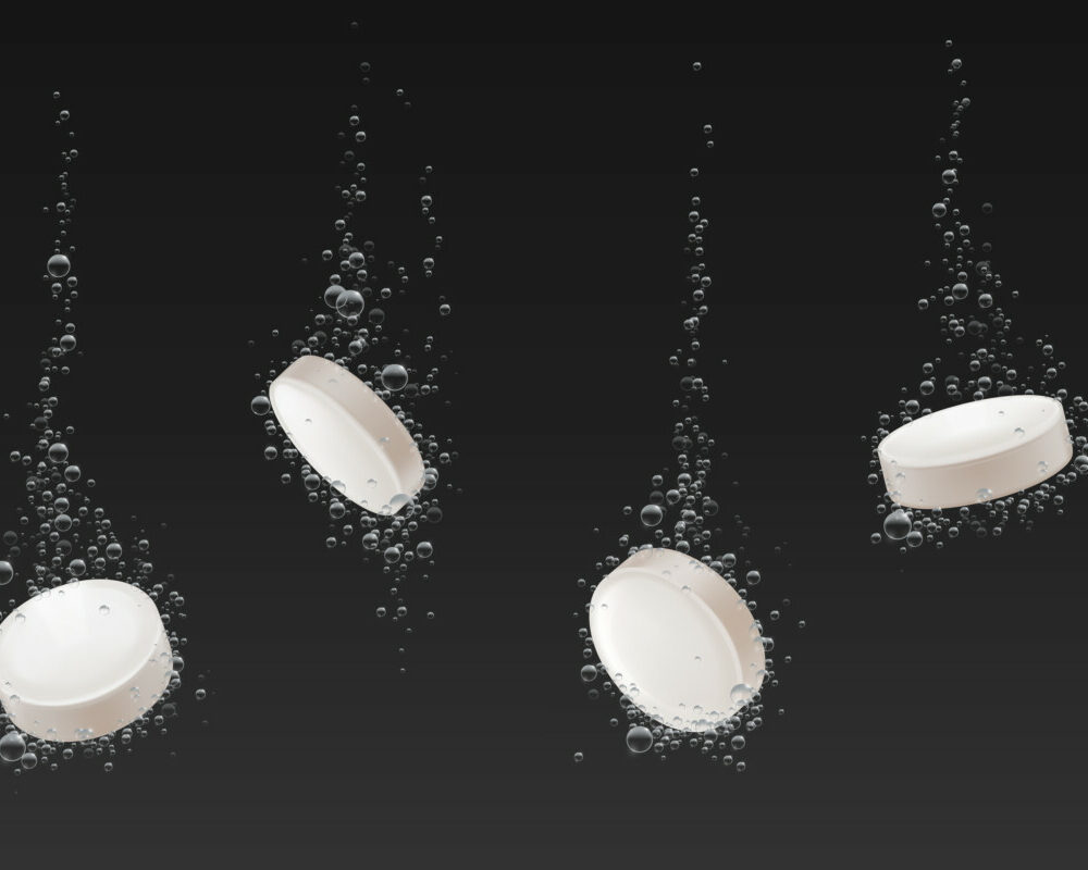 soluble-pills-with-fizz-air-bubbles-trail-water-effervescent-falling-aspirin-tablets-vitamin-c-heada