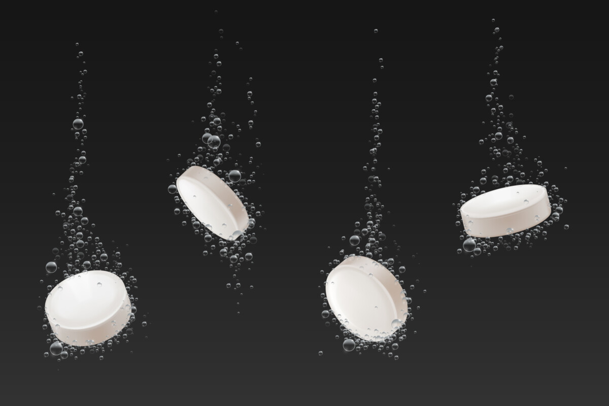 soluble-pills-with-fizz-air-bubbles-trail-water-effervescent-falling-aspirin-tablets-vitamin-c-heada