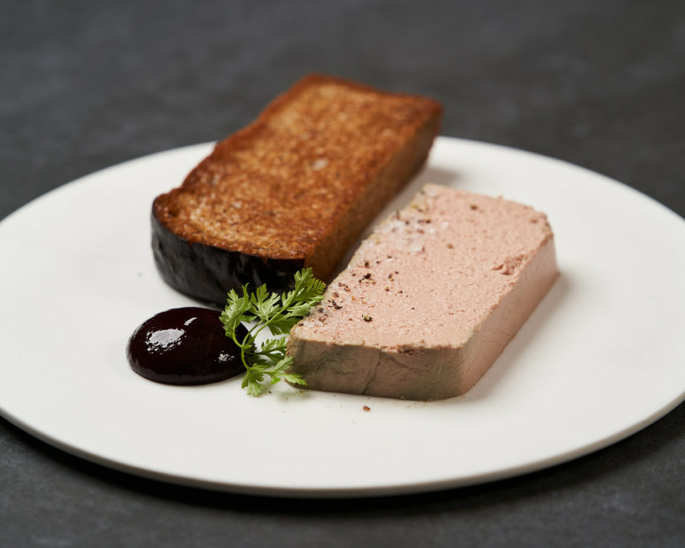 toasted-bread-with-pate-white-plate-dark-background-with-copy-space-close-up (1)