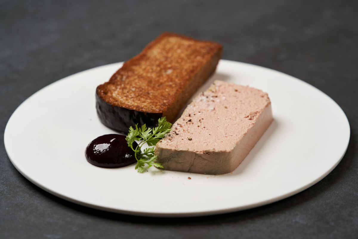 toasted-bread-with-pate-white-plate-dark-background-with-copy-space-close-up (1)