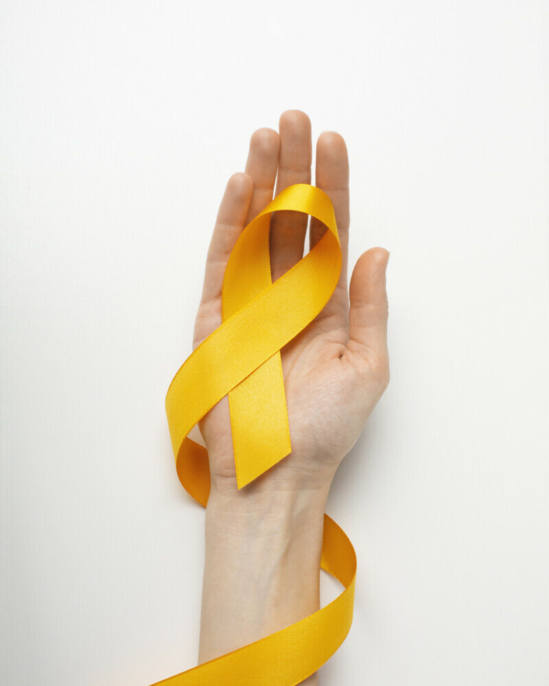 view-yellow-ribbon-with-human-hand