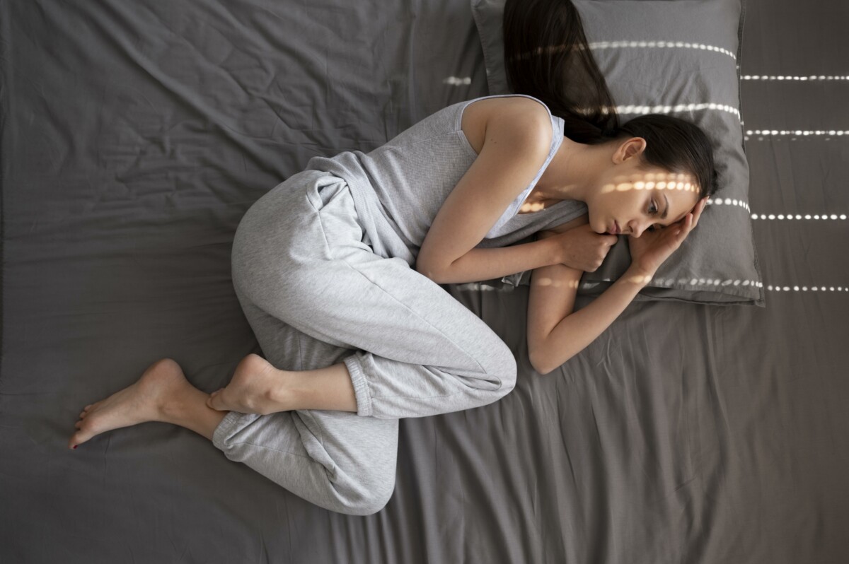 full-shot-woman-with-anxiety-bed